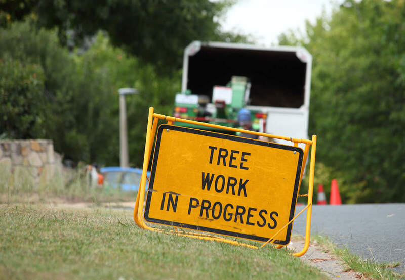 Tree work in progress signage, maintaining safety while at work